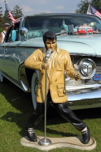 Elvis In Front Of A Plymouth
